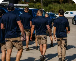 Plumbers walking to their service vans on a Strathfield job
